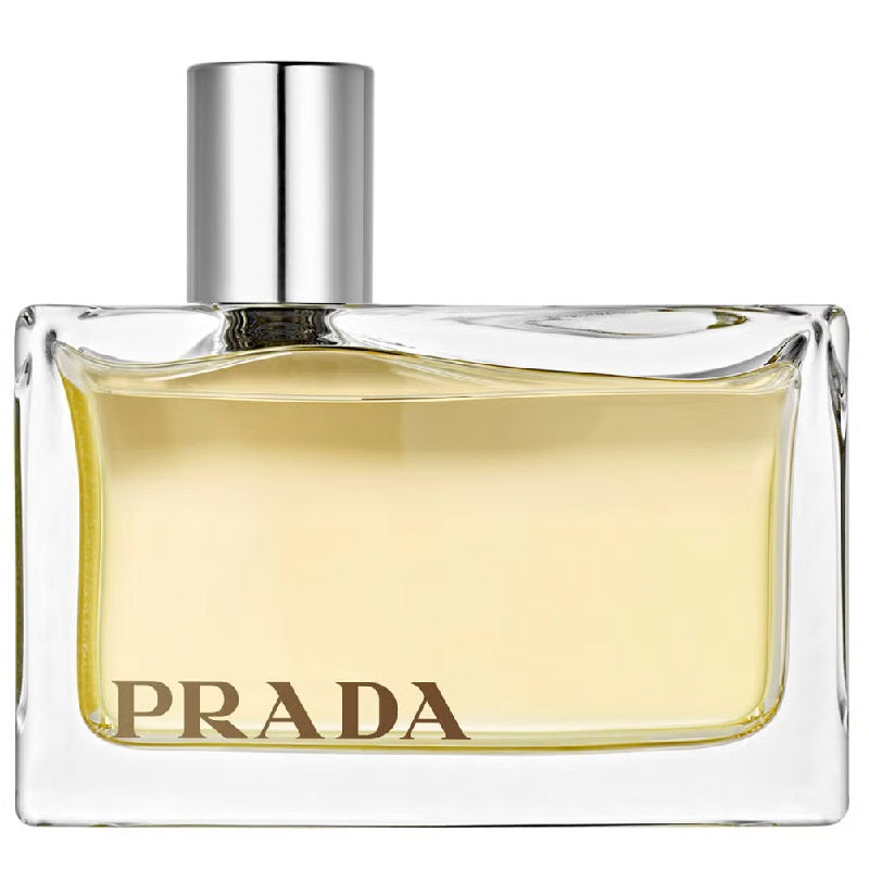 Prada perfume bottle with a clear glass container and silver cap on a white background