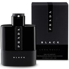 A black bottle of Prada Luna Rossa eau de parfum for men, alongside its packaging box. The bottle has a sleek design with the Prada logo visible.