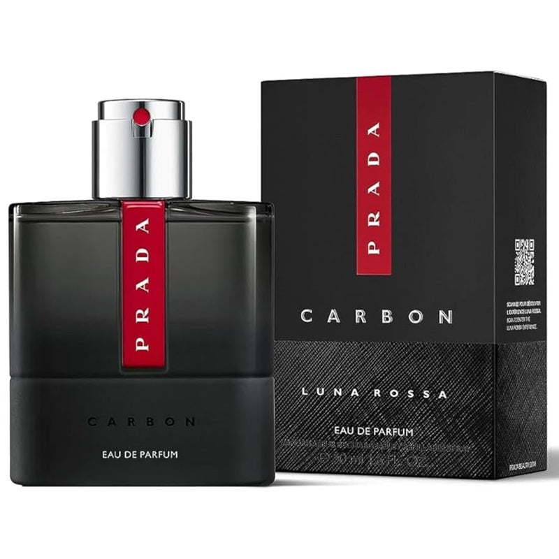 Prada Carbon Luna Rossa Eau de Parfum bottle and packaging box. The bottle is a dark, translucent black glass with a polished silver pump and a vertical red label featuring the white Prada logo.