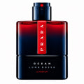 Prada Ocean Luna Rossa Le Parfum bottle, featuring a dark blue to red gradient glass body with a vertical red label displaying the Prada logo, on a solid white background.