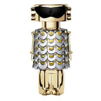 A bottle of Fame (80ml) Eau de Parfum by Paco Rabanne, featuring a design with gold and silver elements and a geometric pattern.