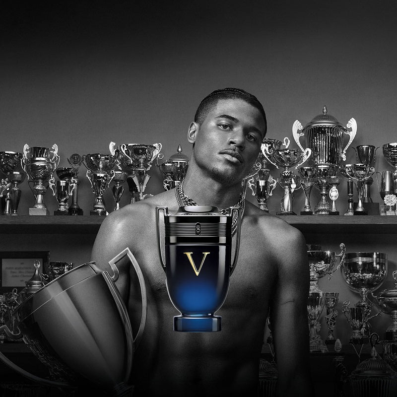 Lifestyle Image: Invictus Victory Elixir Intense 100 ml Eau de Parfum by Rabanne – captured in a dramatic, victorious setting evoking ambition, dominance, and refined intensity.