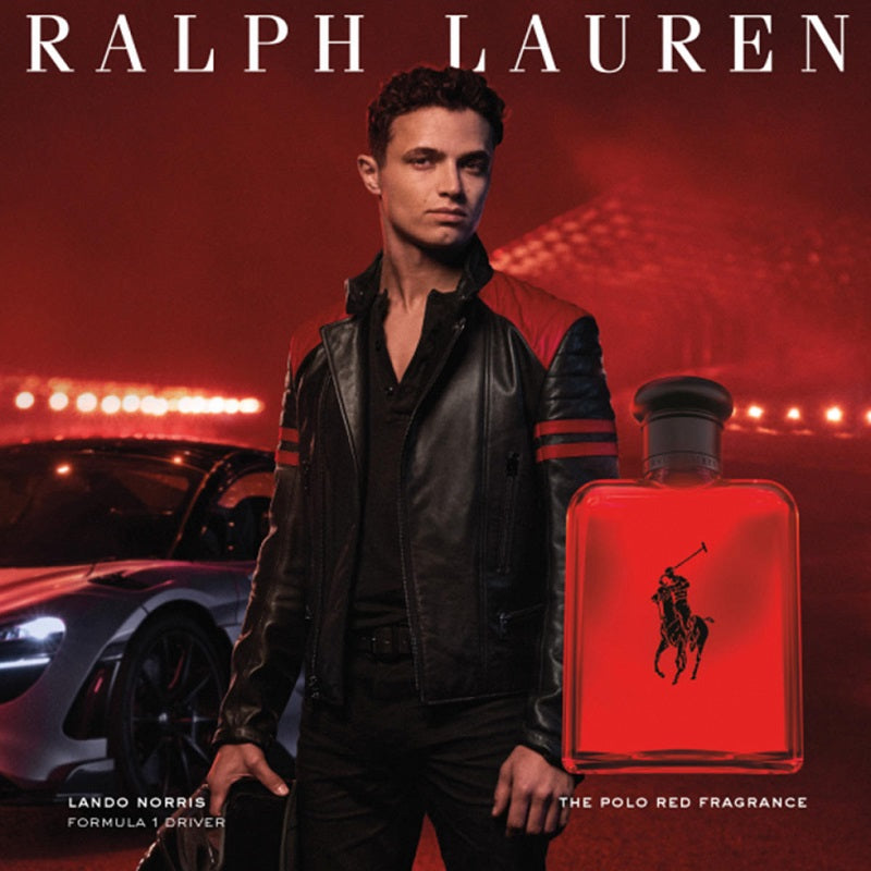 Person holding a Ralph Lauren Polo Red fragrance bottle with a car in the background