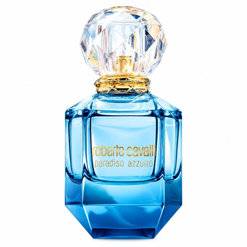 A bottle of Roberto Cavalli Paradiso Azzurro perfume with a faceted blue glass body, gold lettering, and a clear crystal cap on a white background.
