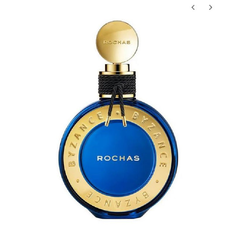 A blue bottle of Byzance Eau de Parfum by Rochas with a gold cap and label.
