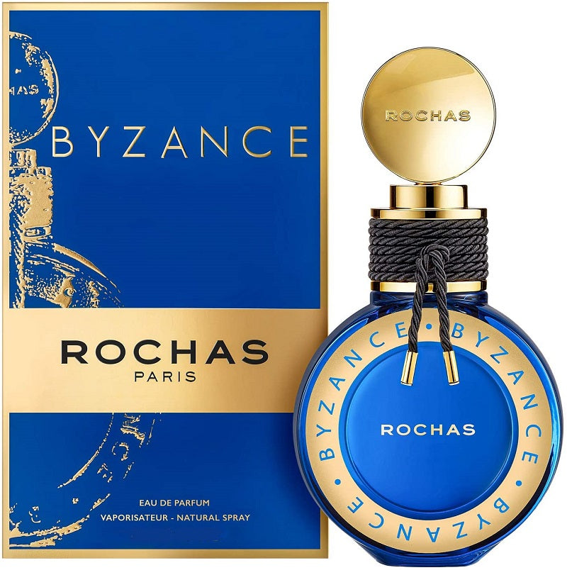 A product image featuring the Rochas Byzance eau de parfum in a blue bottle with gold details, next to its packaging.