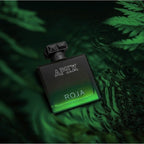 Roja Parfums Apex perfume bottle on a green leafy background