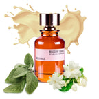 Perfume bottle with vanilla flowers and leaves on a white background