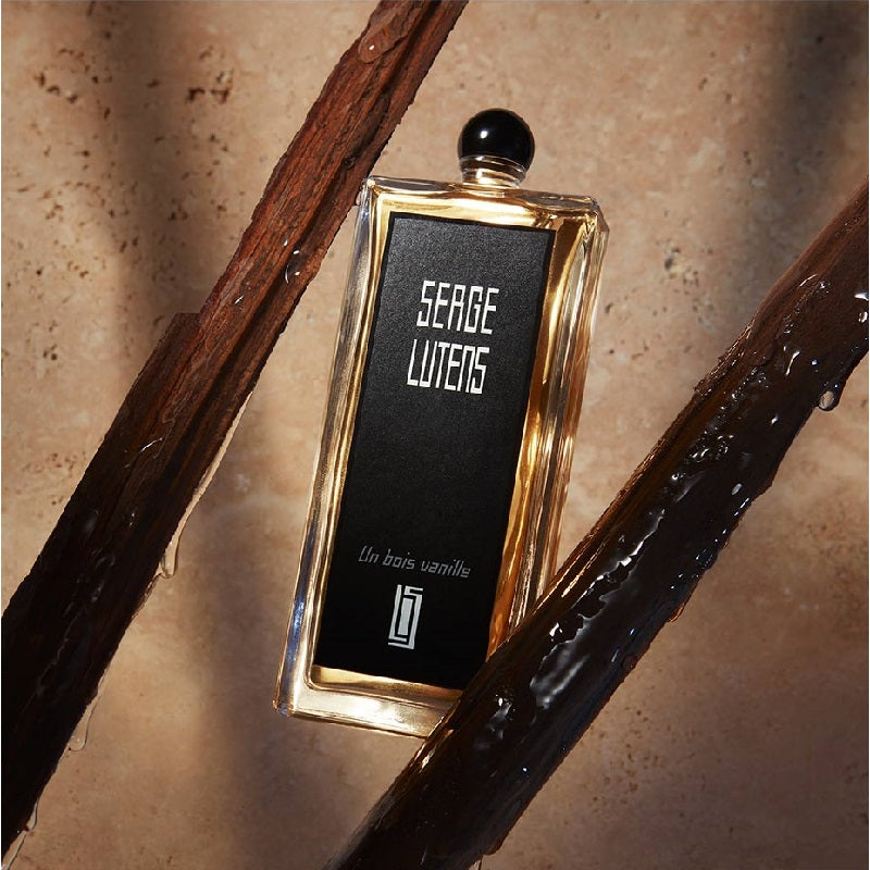 Un Bois Vanille bottle in a warm, golden setting evoking comfort, refinement, and quiet luxury.