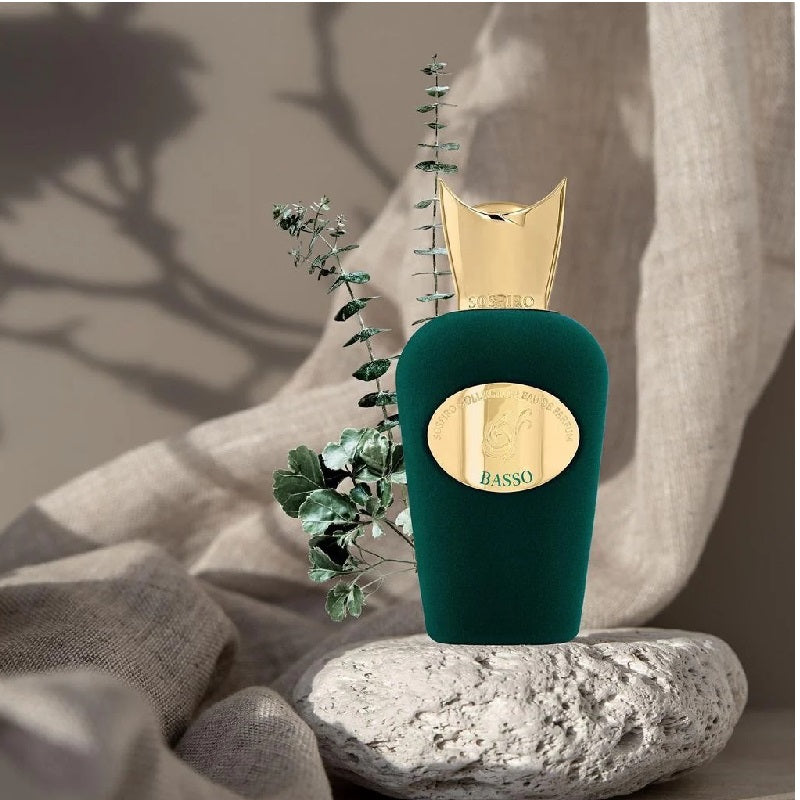 Green bottle of Sospiro with a garden design on a white background