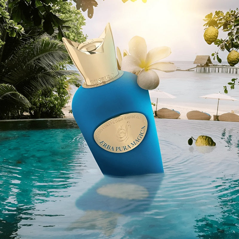Blue perfume bottle with gold cap in a pool setting
