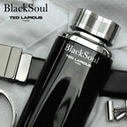 BlackSoul Ted Lapidus perfume bottle with silver cap on a textured surface