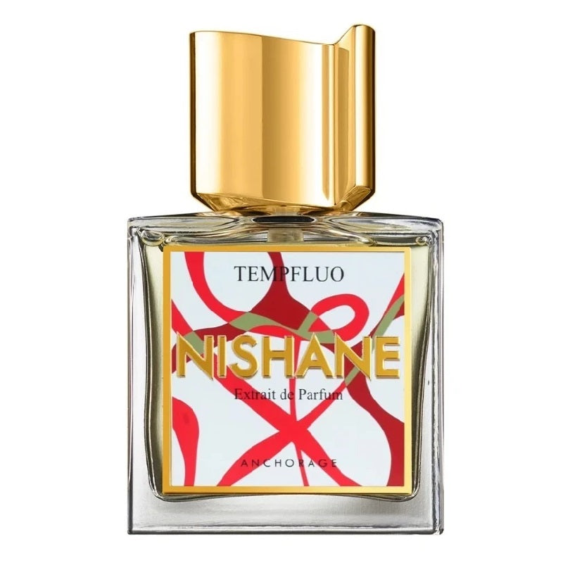 A square-shaped perfume bottle with a clear glass body and a gold-colored cap. The label features the brand name NISHANE in red and white text.