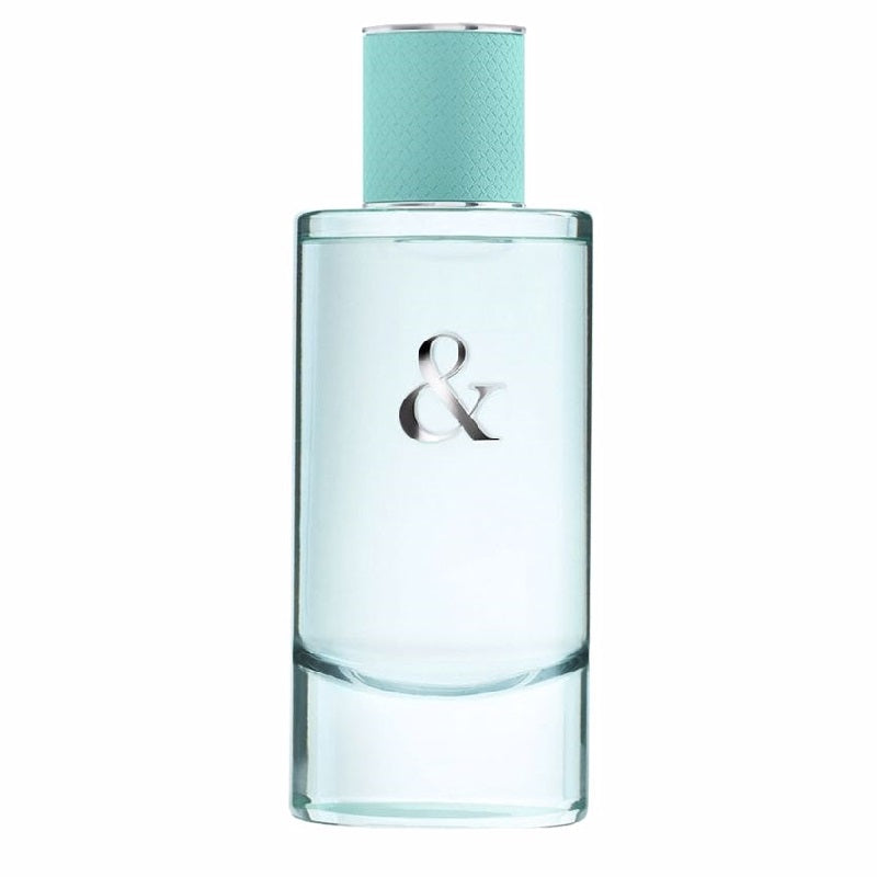 Perfume bottle with a light blue cap and clear body on a white background