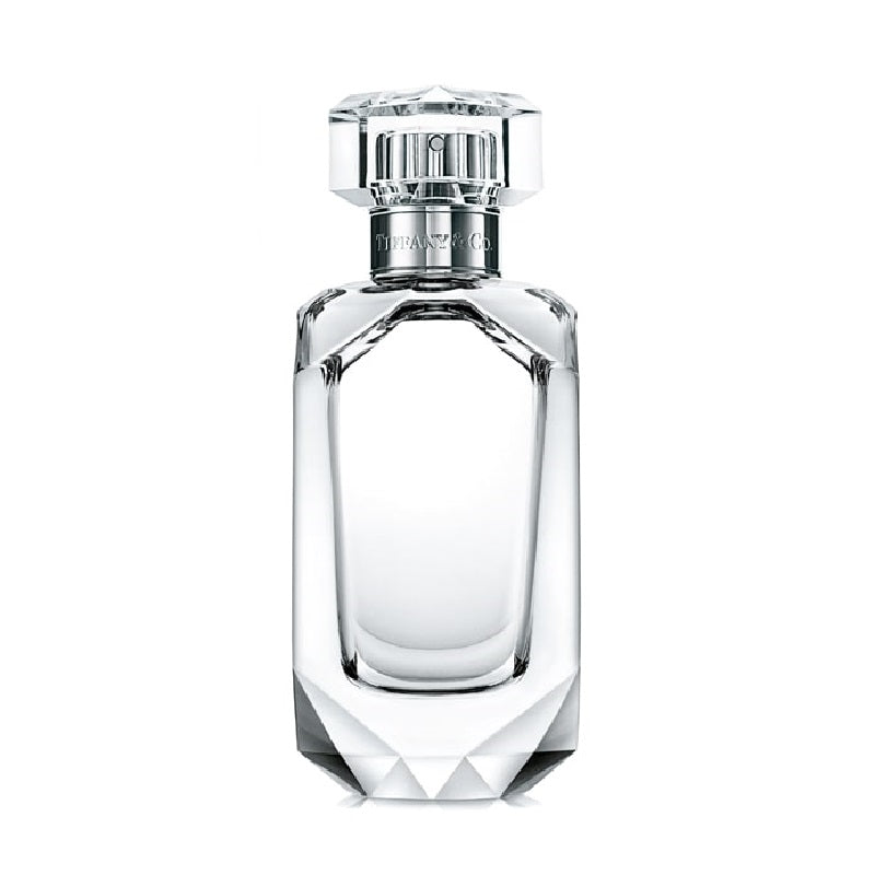 Clear perfume bottle with silver cap on a white background