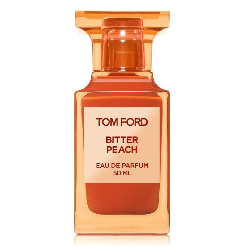 A 50ml bottle of Tom Ford Bitter Peach Eau de Parfum with a clear, orange tinted liquid visible inside the bottle.