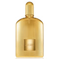 A golden, glass bottle of Tom Ford Black Orchid Parfum with a ribbed texture and a brand label on the front.