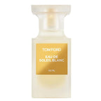 A white bottle of Tom Ford Eau De Soleil Blanc perfume with a gold label.