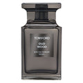 A 100ml bottle of Tom Ford Oud Wood Eau de Parfum with a dark tinted liquid visible through the clear glass bottle and a black cap.