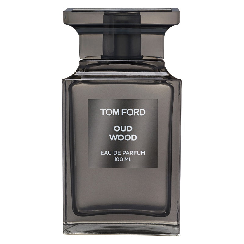A 100ml bottle of Tom Ford Oud Wood Eau de Parfum with a dark tinted liquid visible through the clear glass bottle and a black cap.