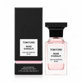 Tom Ford Rose D'Amalfi Eau de Parfum presentation with the blush-pink bottle beside the matching luxury retail box on a pure white background.