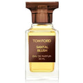 A glass bottle of Tom Ford Santal Blush Eau de Parfum with a brown cap and a label indicating it is a 50ml perfume.