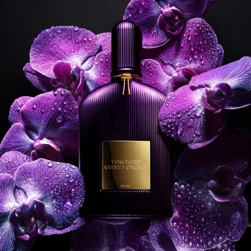 Tom Ford perfume bottle with purple orchids on a dark background