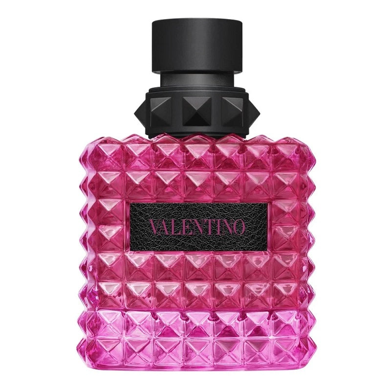 Pink diamond-patterned perfume bottle with black cap on a white background