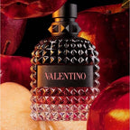 Valentino perfume bottle with red fruits in the background
