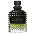 Valentino Uomo Born in Roma Green Stravaganza perfume bottle with black cap and textured green liquid inside.