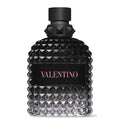 A black bottle of Valantino Uomo Born in Roma eau de toilette with a textured design and the brand name 'VALENTINO' in pink letters.