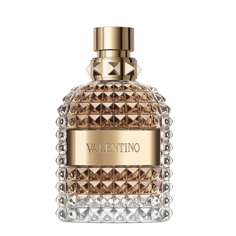 Valentino perfume bottle with gold cap and diamond-patterned design on a white background