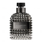 A black bottle of Valentino Uomo Intense eau de parfum with a textured design and the brand name prominently displayed.