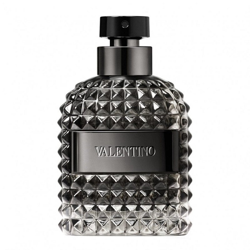 A black bottle of Valentino Uomo Intense eau de parfum with a textured design and the brand name prominently displayed.