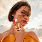 Voce Viva - white orange blossoms, warm golden light, luxurious red velvet and contemporary couture fashion, expressing confidence, femininity and the power of self-expression.