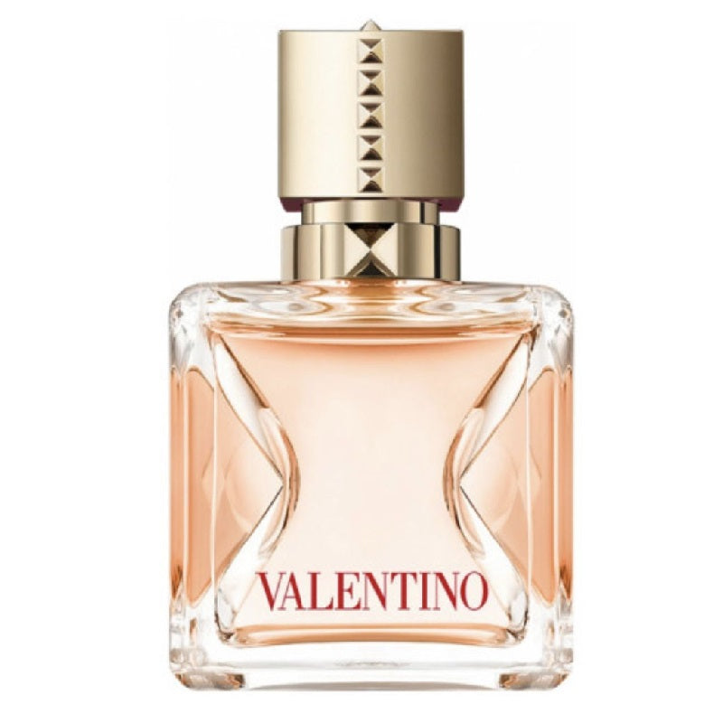 A clear glass bottle of Valentino Voce Viva Intensa eau de parfum with a gold cap and pink-toned liquid visible inside.