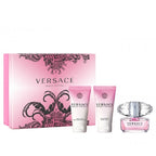 Versace perfume set with pink packaging on a white background