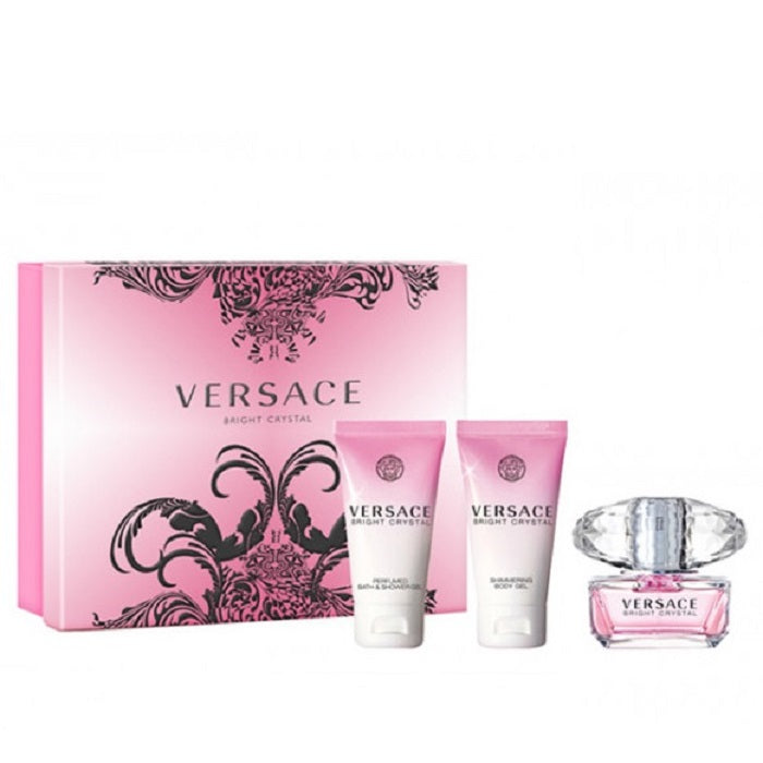 Versace perfume set with pink packaging on a white background