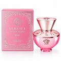 Versace Dylan Blush pink Eau de Parfum natural spray bottle next to its pink packaging box, featuring the iconic Medusa logo and rose gold metallic accents.