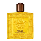 Versace Eros Energy perfume bottle with geometric design and bronze cap on white background