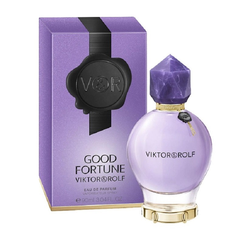 Pack Image: Viktor & Rolf Good Fortune Eau de Parfum presentation with the purple crystal-inspired bottle beside the matching luxurious purple and gold retail box on a pure white background