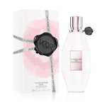 A product image showing the packaging and bottle of Flowerbomb Dew Eau de Parfum by Viktor & Rolf. The packaging is predominantly white with floral motifs and the bottle is white with a silver cap.