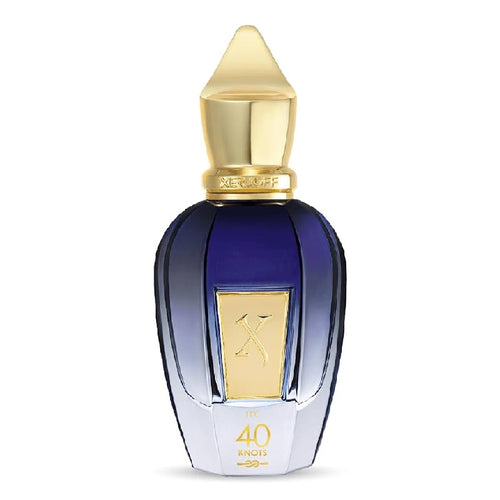 A luxury perfume bottle with a faceted dark blue glass body, a metallic gold cap, and a gold label featuring a stylized 'X' logo. The base of the bottle is white with gold lettering that reads '40 ENOIS'.
