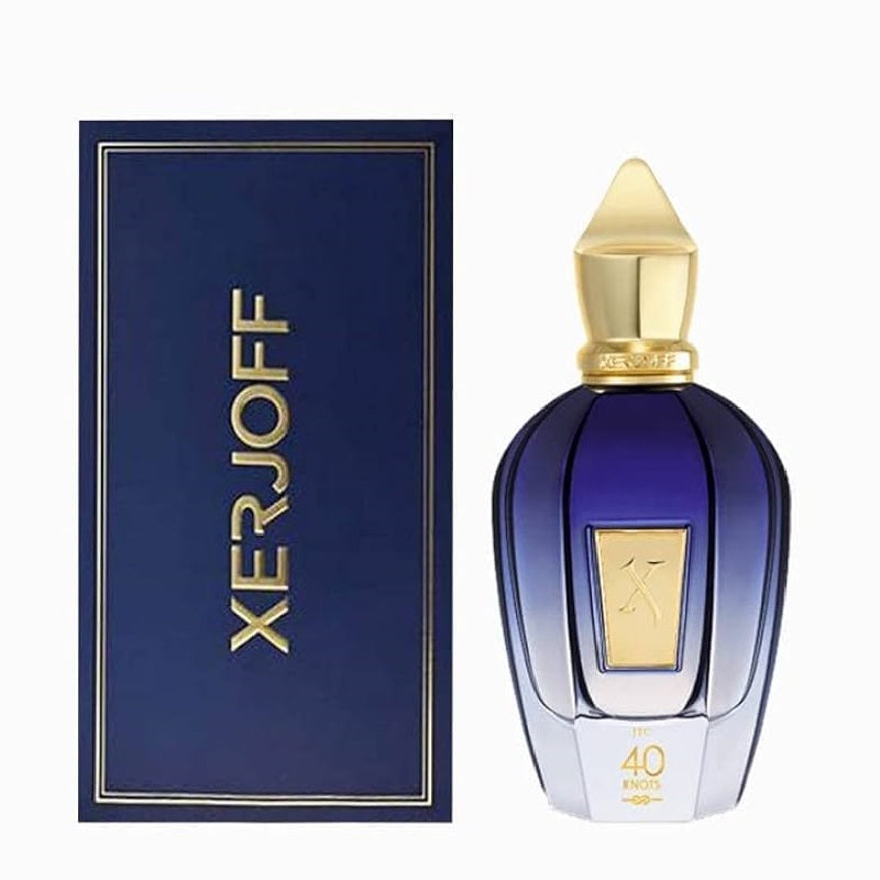 Xerjoff perfume bottle in deep blue glass with a gold cap, shown next to its dark blue box with gold lettering on a white background.