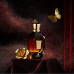 Luxury perfume bottle with gold accents on a dark background