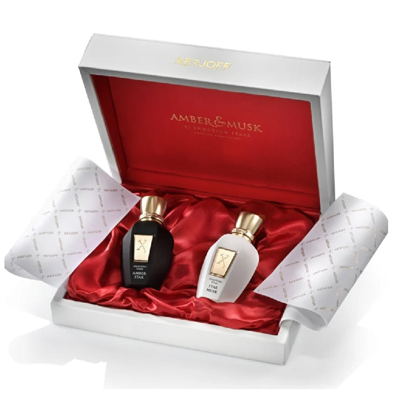 Two perfume bottles in a decorative box with 'Amber & Musk' branding.