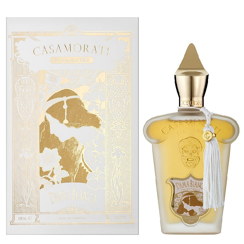 Casamorati Donna Bianca Eau de Parfum bottle with a gold cap and white tassel, shown next to its white and gold illustrated packaging box.