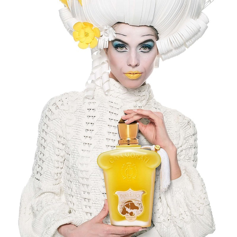 Dama Bianca Casamorati Parfum by Xerjoff styled with white florals, soft vanilla and refined luxury accents reflecting grace, elegance and timeless feminine sophistication.