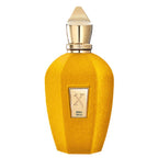 A yellow textured perfume bottle with a gold cap and a gold label reading 'X ERBA GOLD' on a white background.