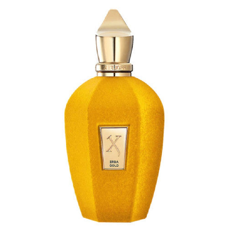A yellow textured perfume bottle with a gold cap and a gold label reading 'X ERBA GOLD' on a white background.